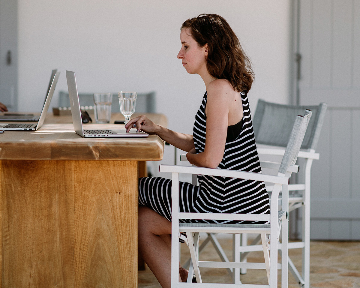 Woman coding on a laptop, on the best path to a web developer job Woman coding on a laptop, on the best path to a web developer job