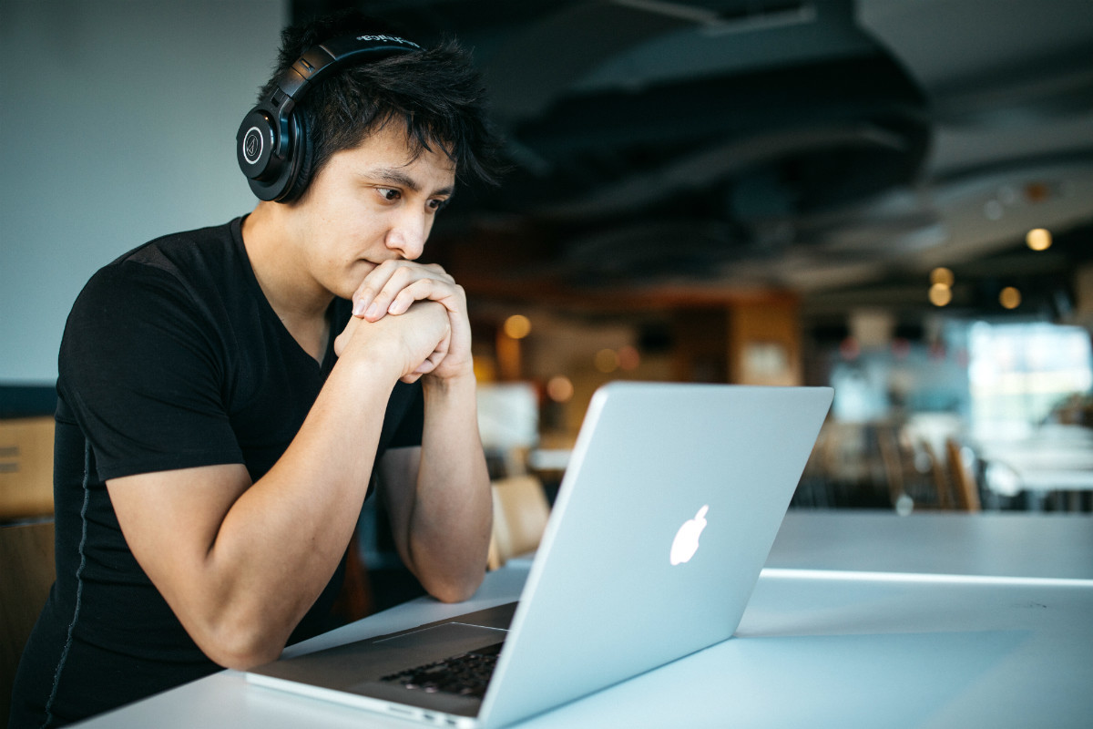 Man at laptop, representing a way one might work in media Man at laptop, representing a way one might work in media