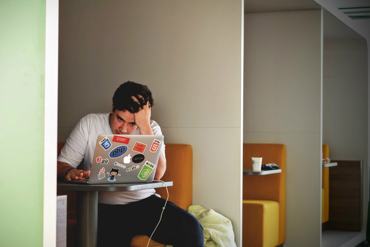 twentysomething at a laptop representing the idea what is coding twentysomething at a laptop representing the idea what is coding