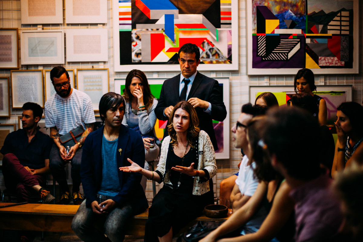 Diverse public meeting led by a woman speaking; representing the Chicago civic tech community Diverse public meeting led by a woman speaking; representing the Chicago civic tech community
