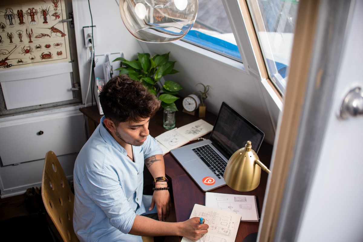person sketch on multiple sketch pads and working at a laptop, representing the idea "what is coding" person sketch on multiple sketch pads and working at a laptop, representing the idea "what is coding"