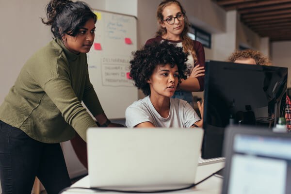 Women learning how to code Women learning how to code